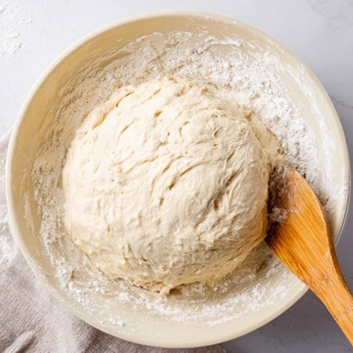 The Best Cinnamon Sugar Soft Pretzel Bites 10 Close-up of freshly mixed dough in a bowl, ready for the next step in the pretzel-making process.
