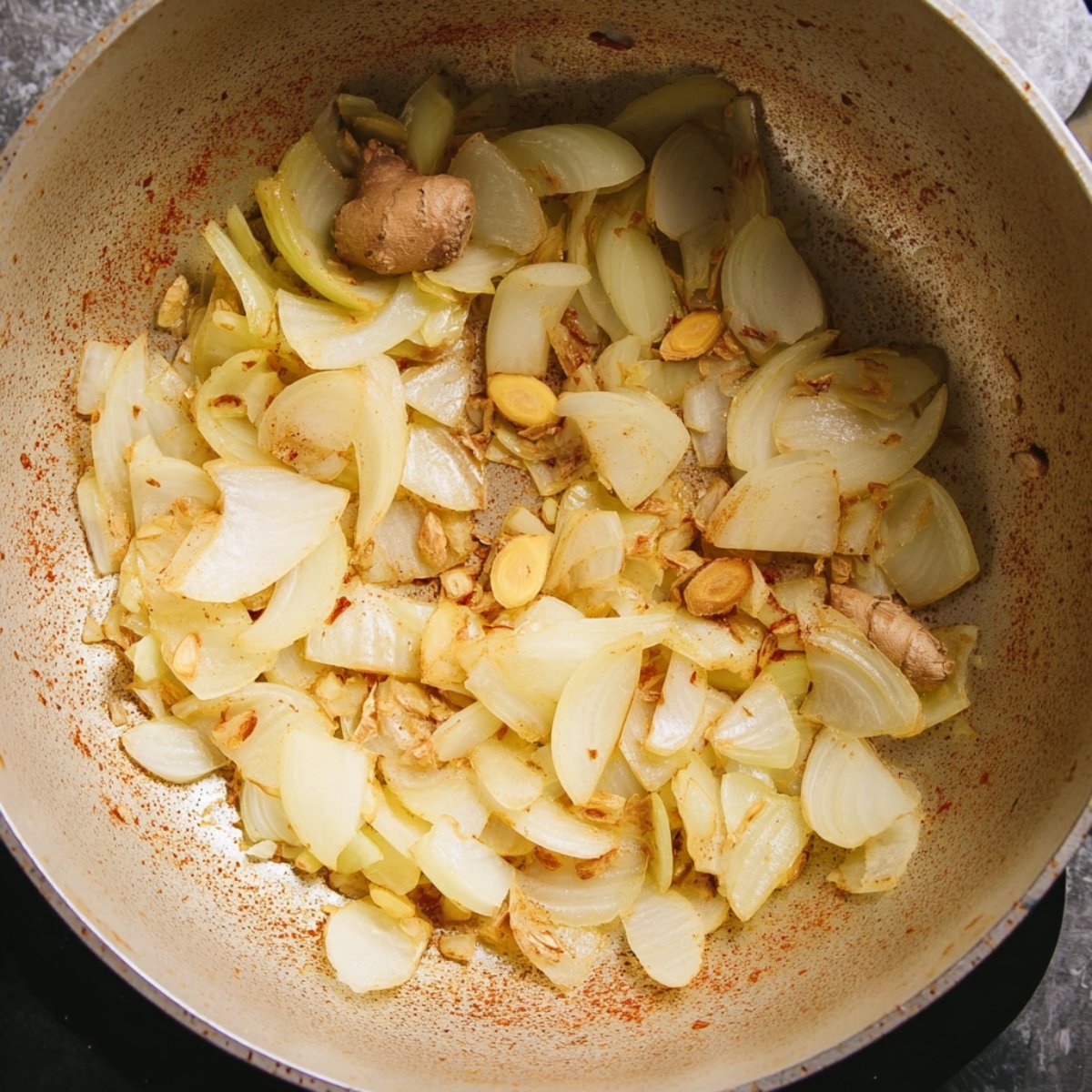 Easy Coconut Lime Fish Soup 10 Sautéed onions with ginger and garlic in a pan, lightly browned.