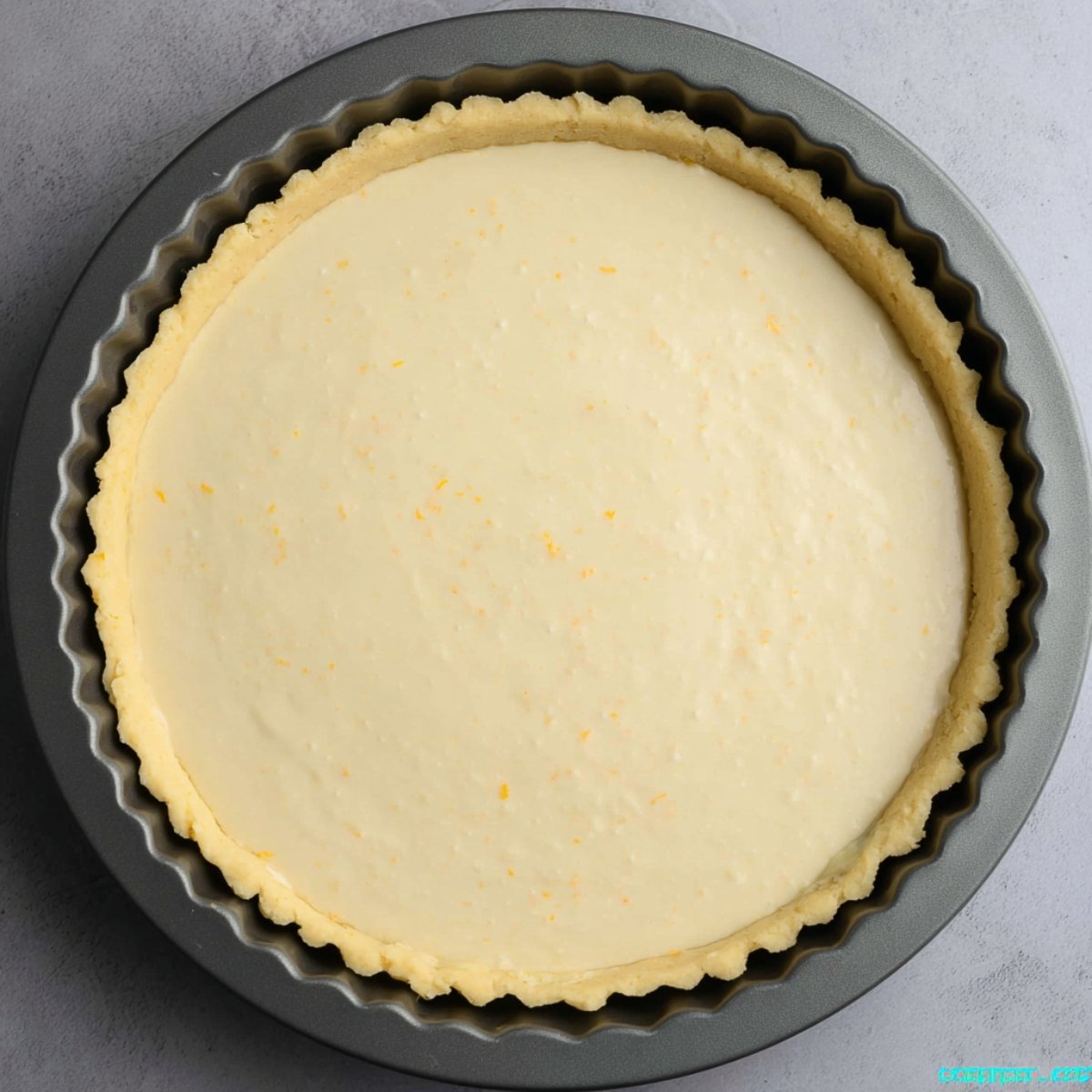 Easy Greek Honey Pie Recipe 11 A pre-baked Greek honey pie crust in a tart pan.