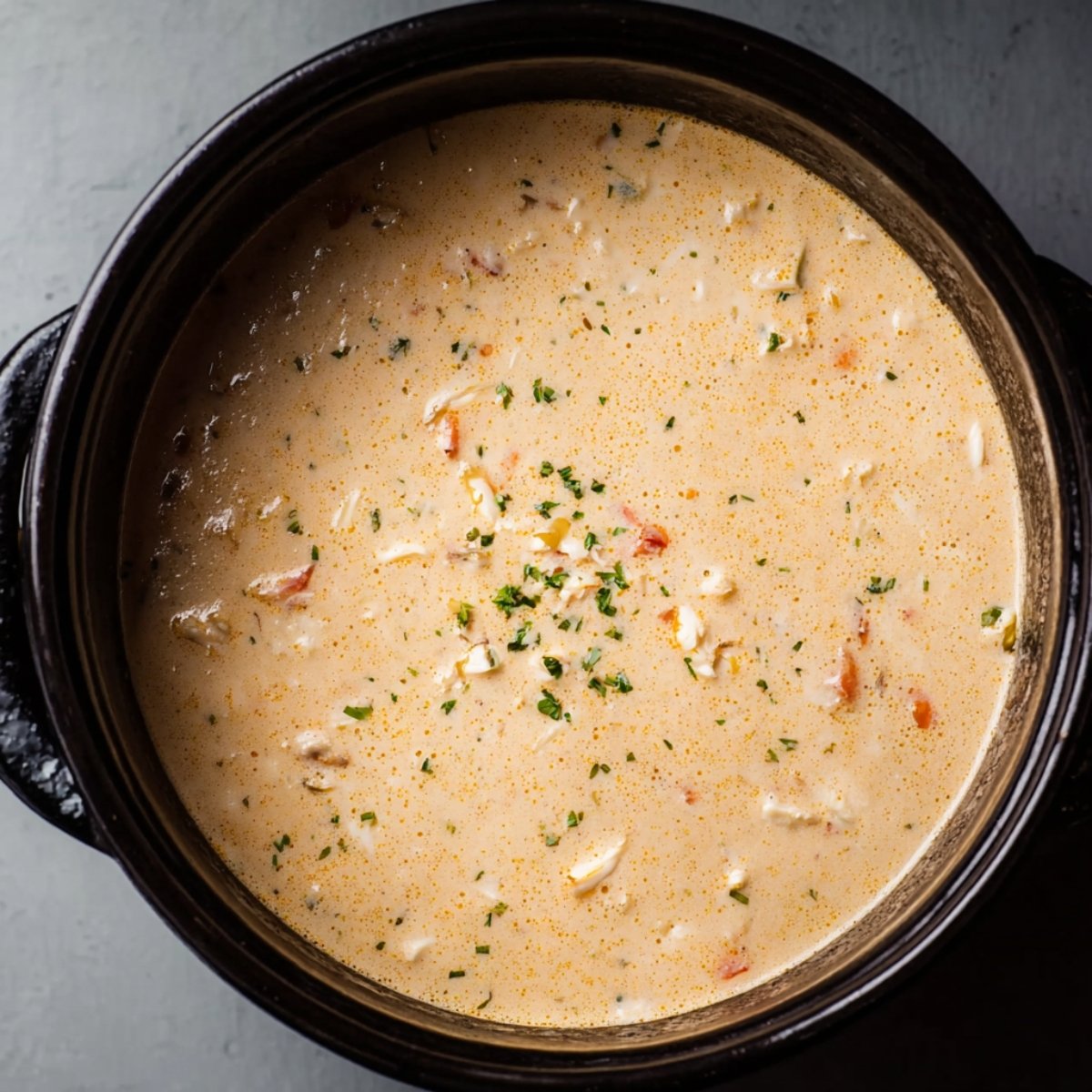 Easy Simple Seafood Bisque 11 Seafood and liquid added to a pot for bisque.