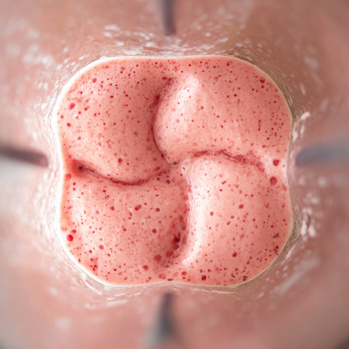 Best Strawberry Banana Smoothie Bowl 11 Pink smoothie in a blender.