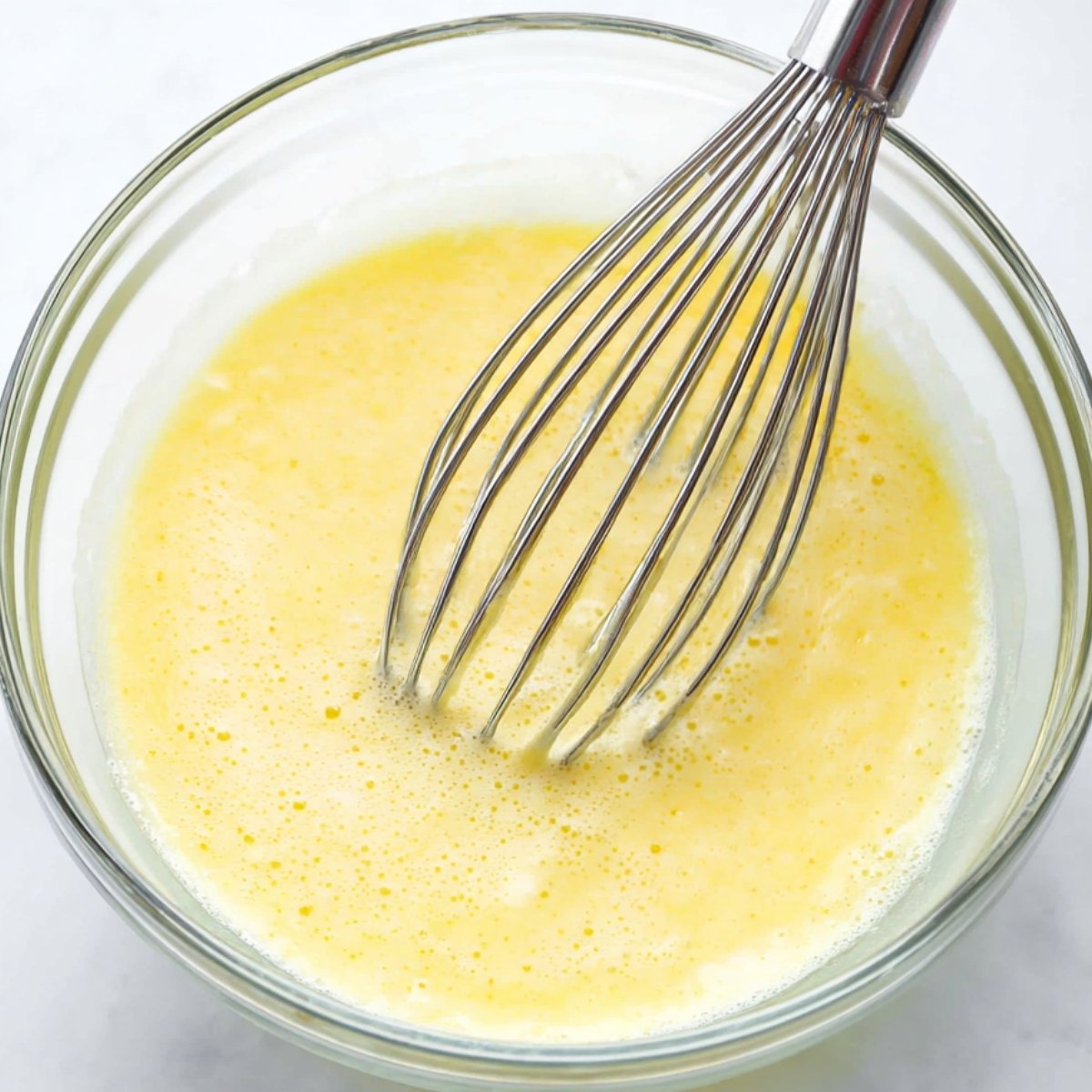 Best Moist Chocolate Cupcakes Recipe 10 Wet ingredients whisked together in a glass bowl.