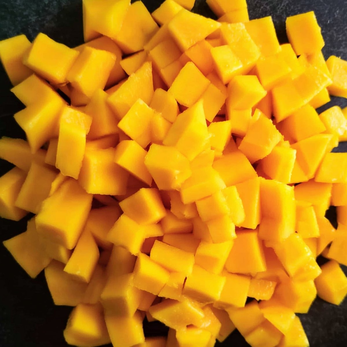 Easy Mango Slaw Recipe 10 Close-up of diced ripe mango cubes.
