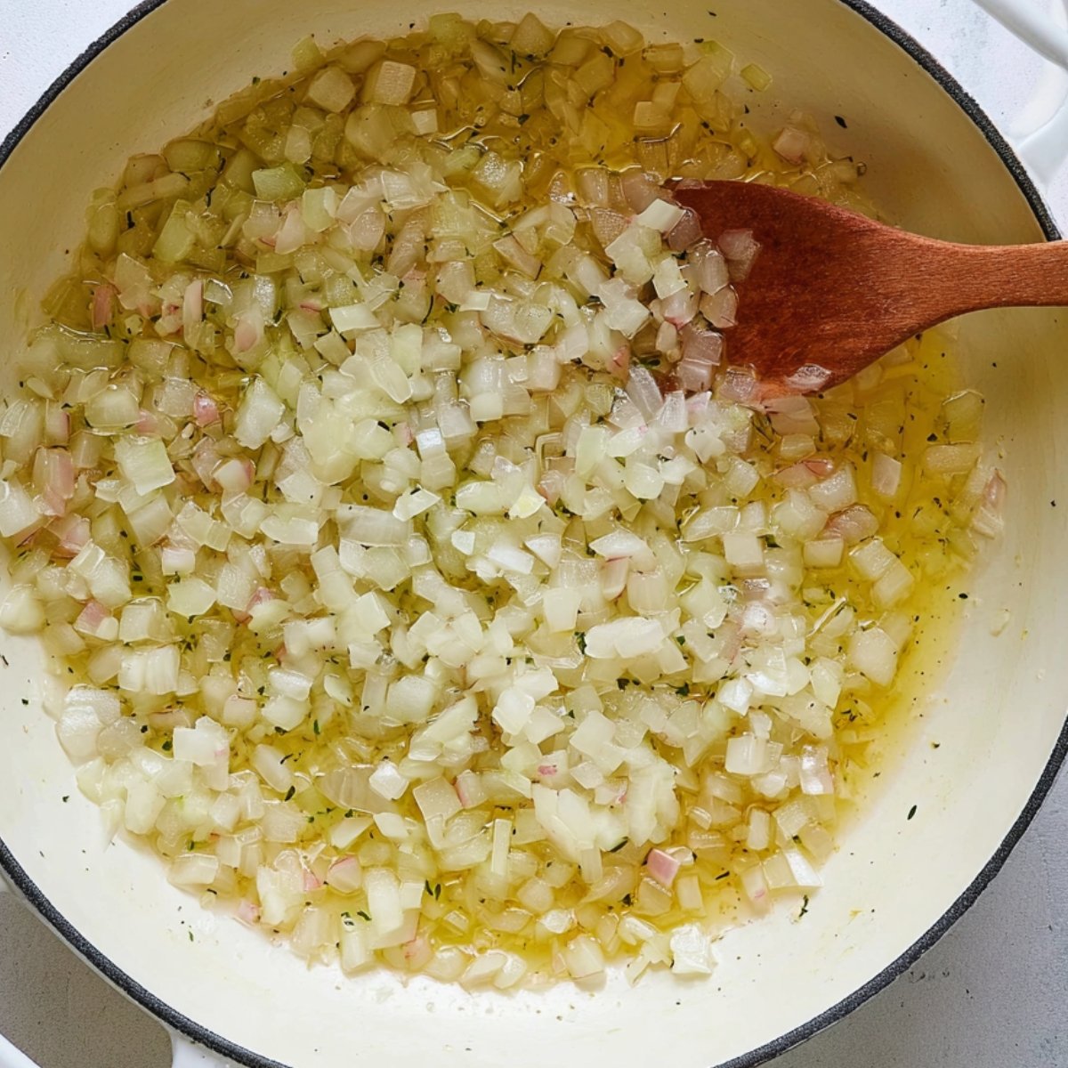 Easy Broccoli Cheddar Soup Recipe 10 Diced onions sautéing in butter in pan.
