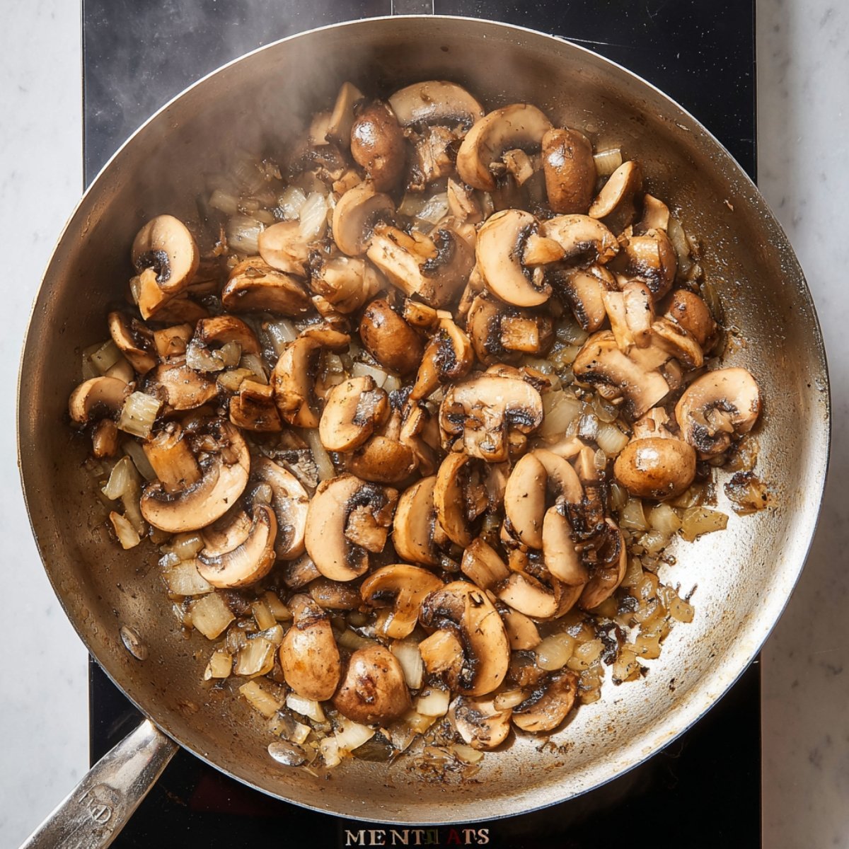 Easy Spinach Mushroom Lasagna 11 Sautéed mushrooms and onions in a pan