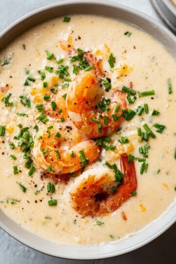 Easy Simple Seafood Bisque 10 Simple Seafood Bisque garnished with shrimp and chopped chives.