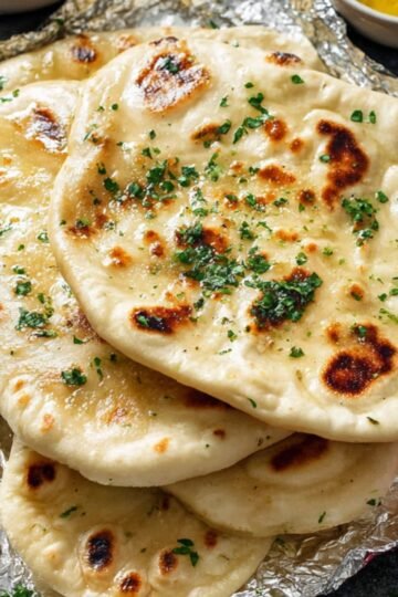 Easy Garlic Pita Bread Recipe 21 Freshly baked garlic pita bread with herbs.