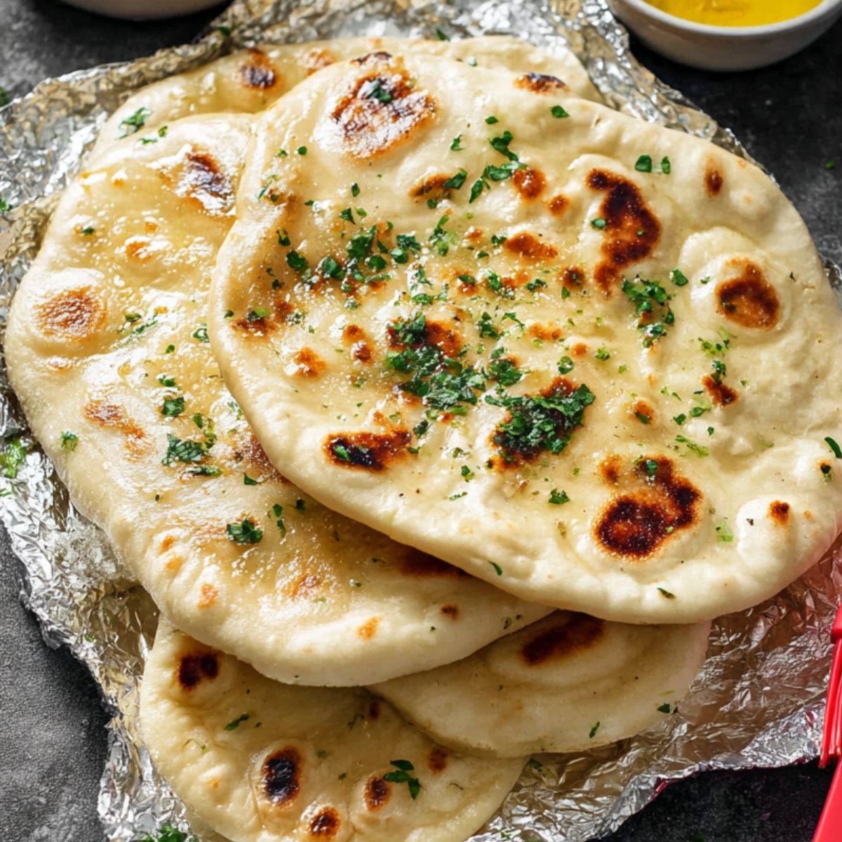 Freshly baked garlic pita bread with herbs.