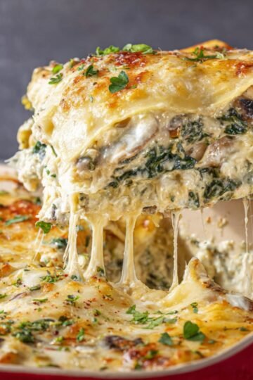 Easy Spinach Mushroom Lasagna 2 Slice of spinach mushroom lasagna with melted cheese